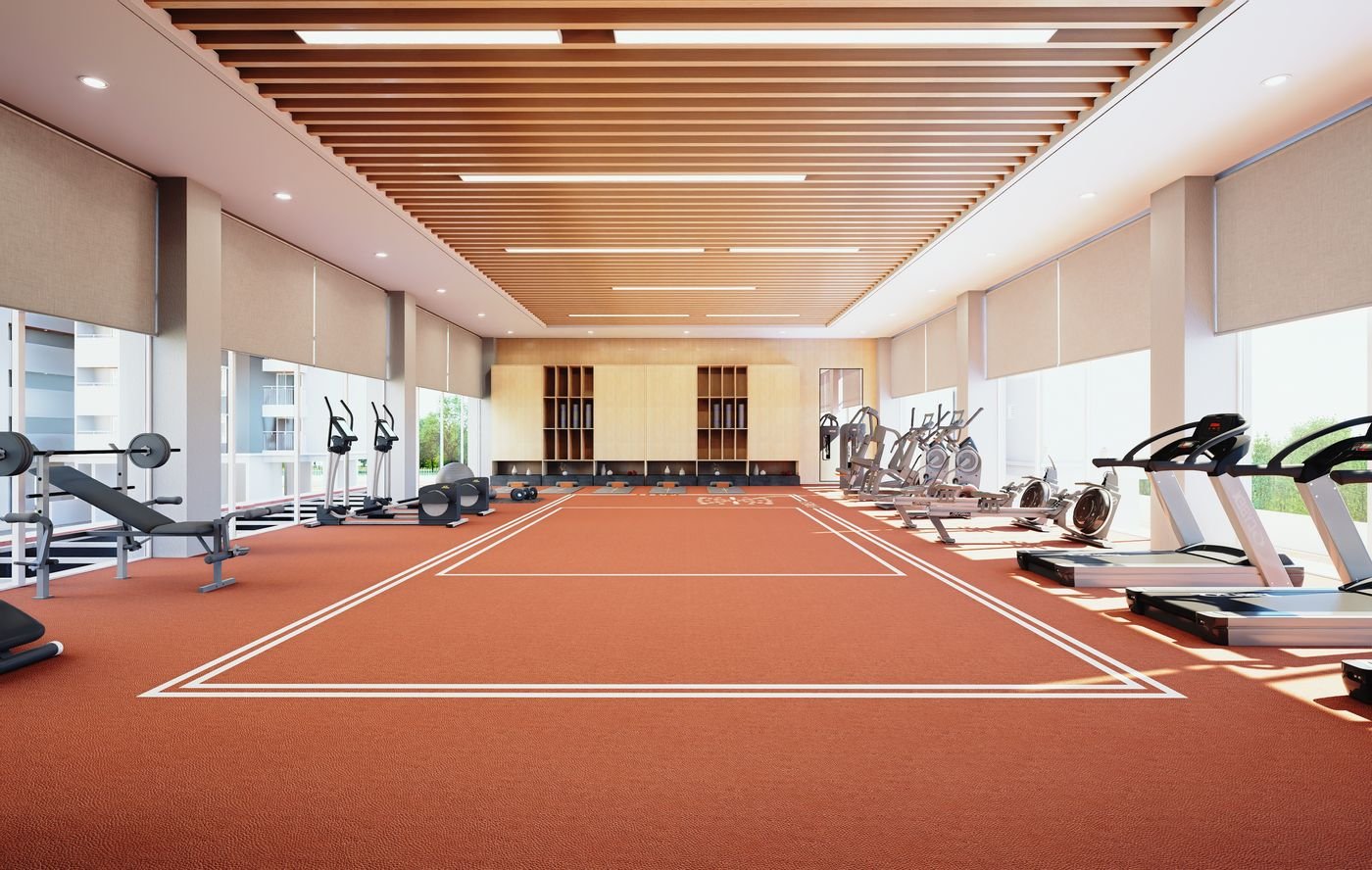 Clubhouse gymnasium with cardio and strength equipment along a glazed wall and a marked functional training floor